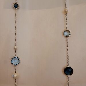 Sterling silver necklace. Bezel set blue topaz.
